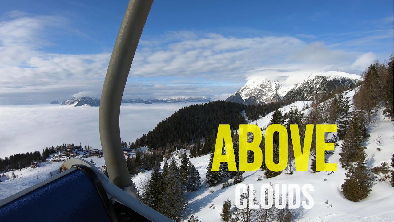 Snowboarding above clouds