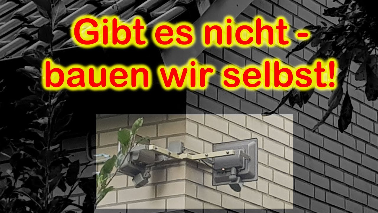 Spezialhalterung f&uuml;r  LED-Strahler an einer Hausecke.