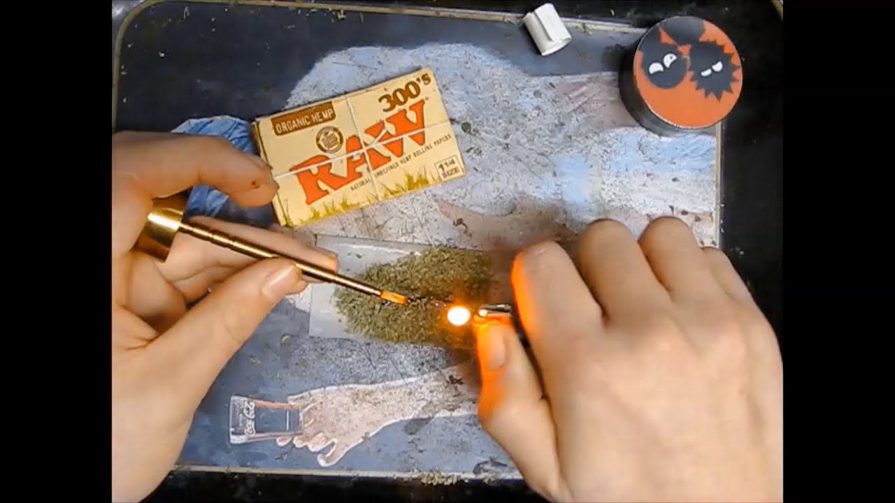 a time lapse/tutorial video of a wax joint being rolled and smoked