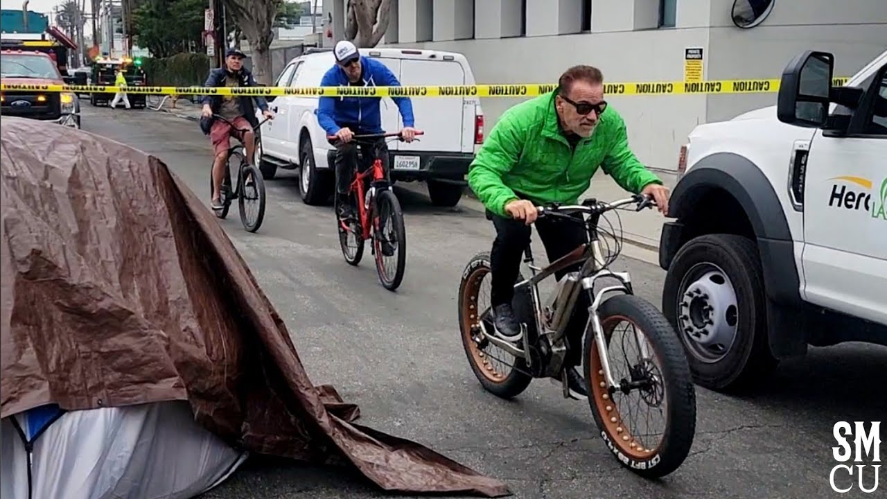 Arnold Schwarzenegger Cycles Through Homeless Encampment Clean-up Next to Golds Gym