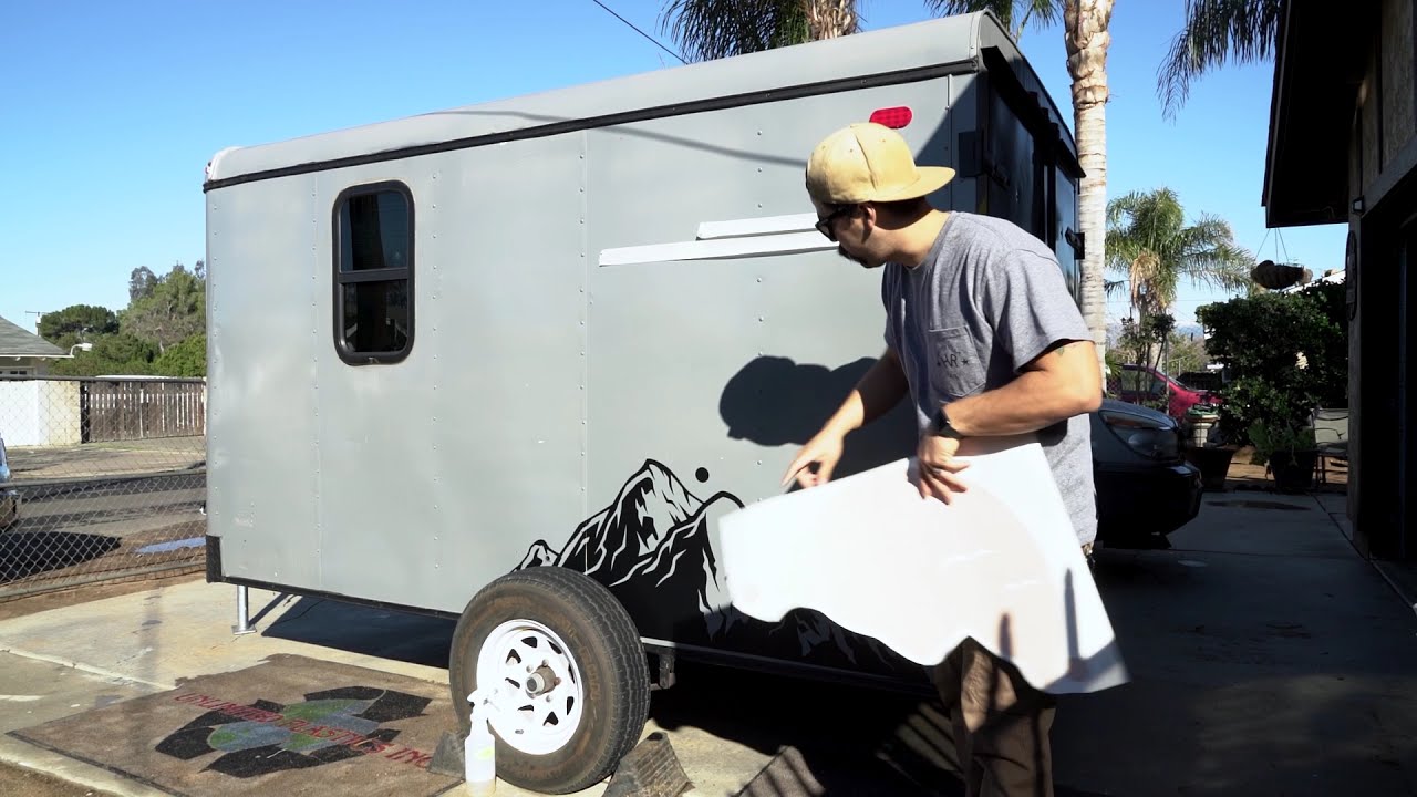 Custom vinyl decal graphic application for cargo trailer conversion