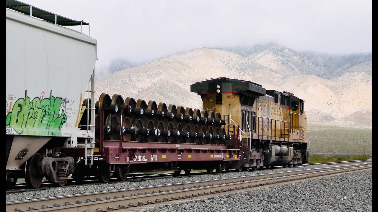 UPRR EB manifest with autos and wheel sets takes the curve heading into Mojave CA