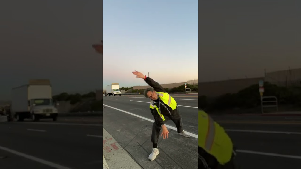 Yoga at daybreak before working on course at the Surf City Marathon