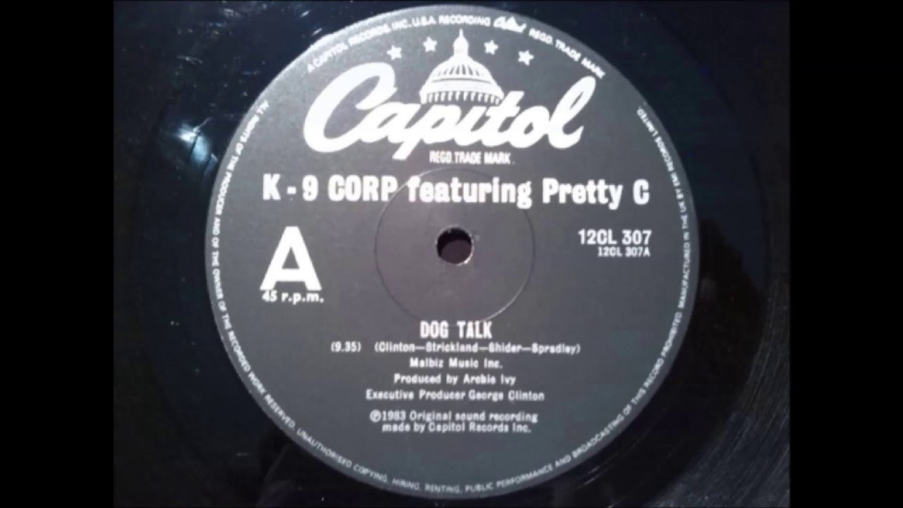 K 9 CORP   FEAT  PRETTY C    -   DOG TALK
