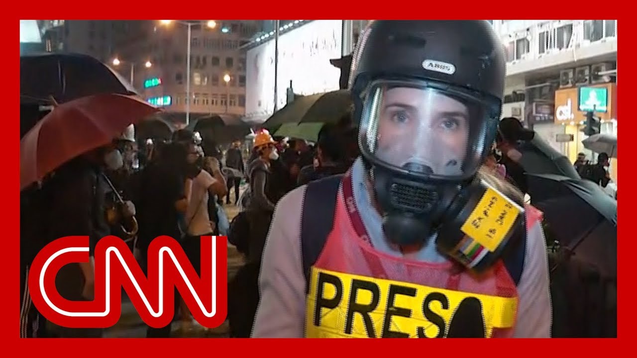 Hong Kong police surround university as standoff with students continues