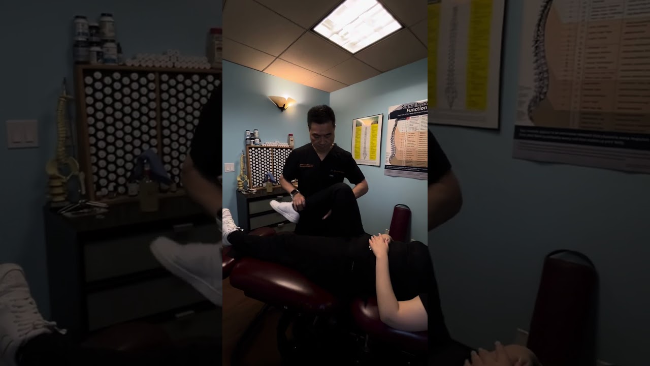 BLACK BELT CHIROPACTOR adjusting a Houston patient with allergies.
