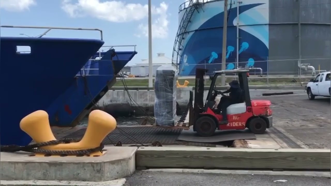 Loading of a cargo ship. Container logistics. Cargo seaport.