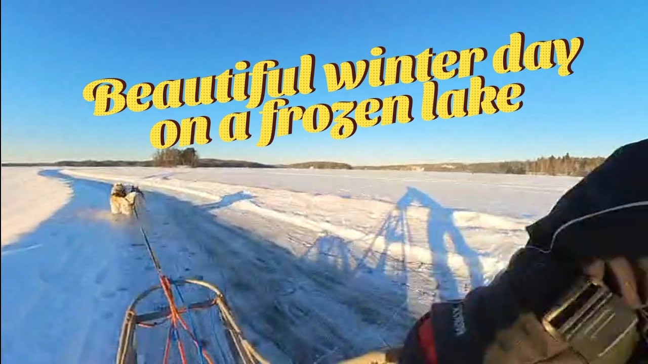 Beautiful winter day sledding on a frozen lake