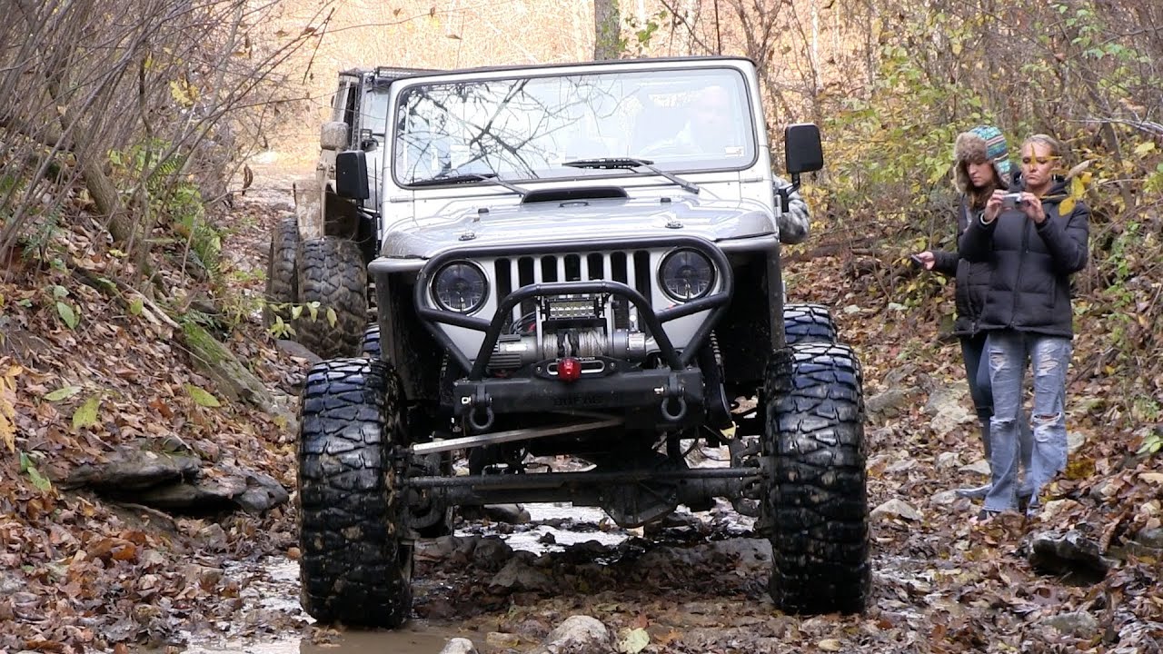 Big Silver LJ Jeep Crawls Over SMORR