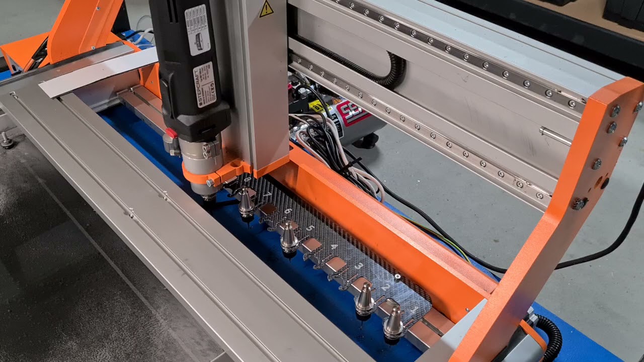 Stepcraft M1000 CNC custom fully automatic tool changer with integrated tool length sensor