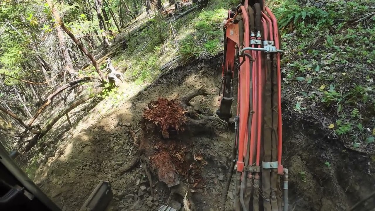 Steep downhill ATV road on 70% grade with the Kubota KX 040 4 excavator