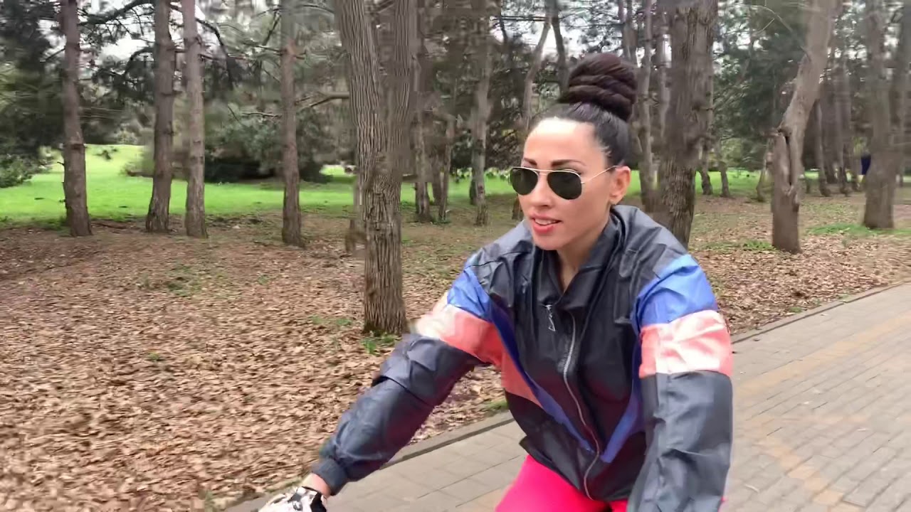 Mila long hair on a bike. Bun, ponytail, braid.