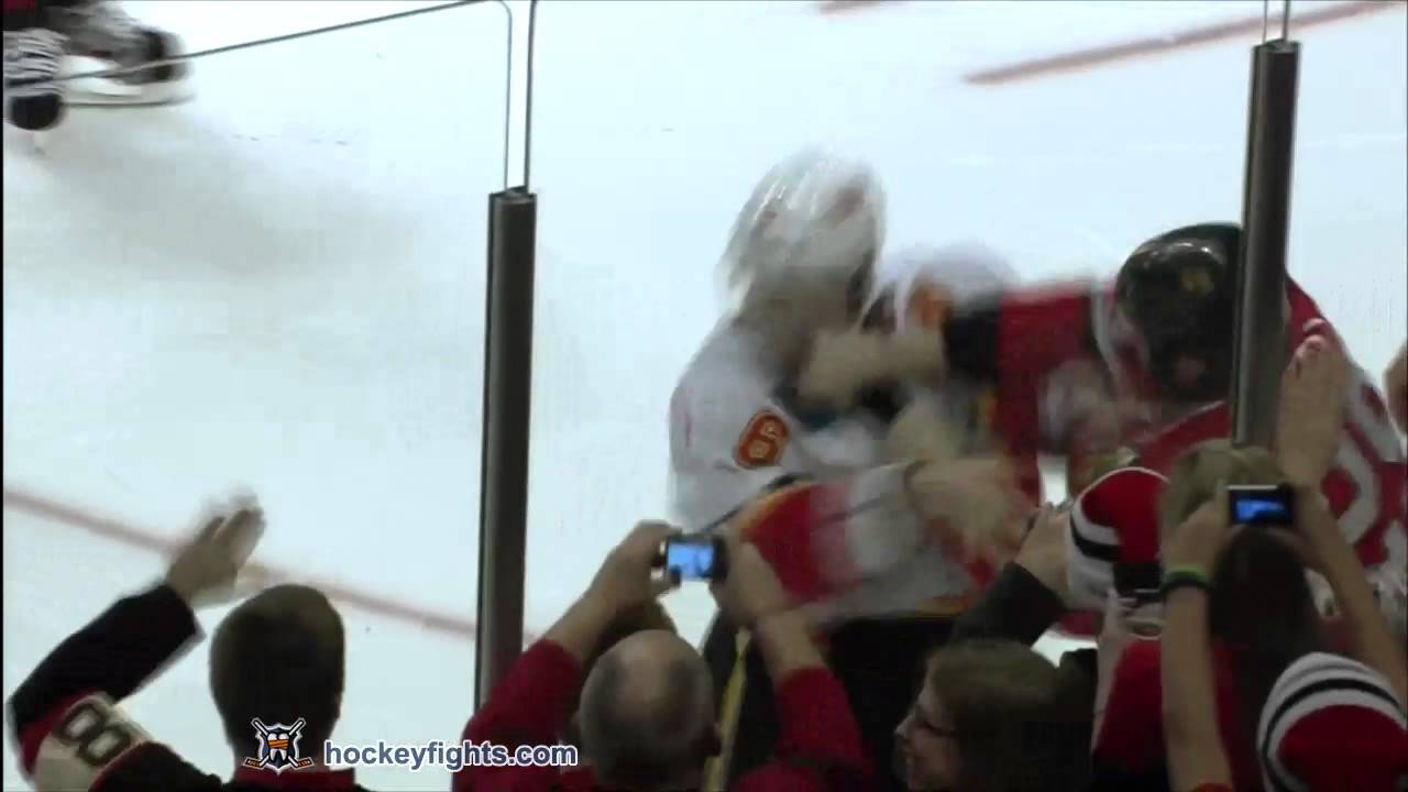 Cory Sarich vs Bryan Bickell Dec 18, 2011