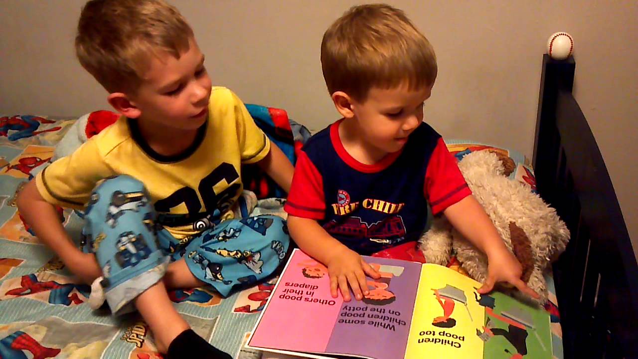 Gavin reading Everyone Poops book