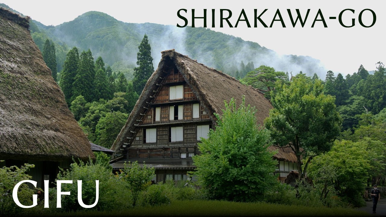 A walk around Shirakawa-go, famous japanese village and World Heritage site. Summer. Pouring rain.