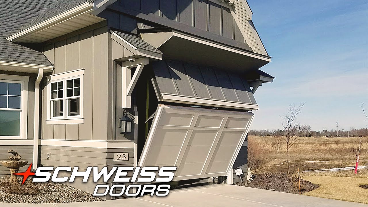 Home with Hidden RV Port and a Schweiss Bifold Garage Door