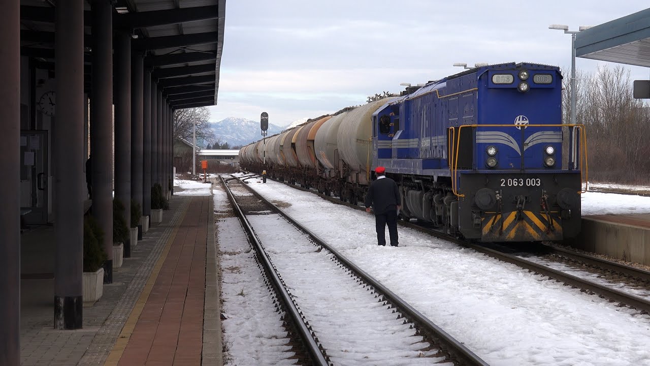 Croatian EMD GT26CW-2 accelerating a train from station