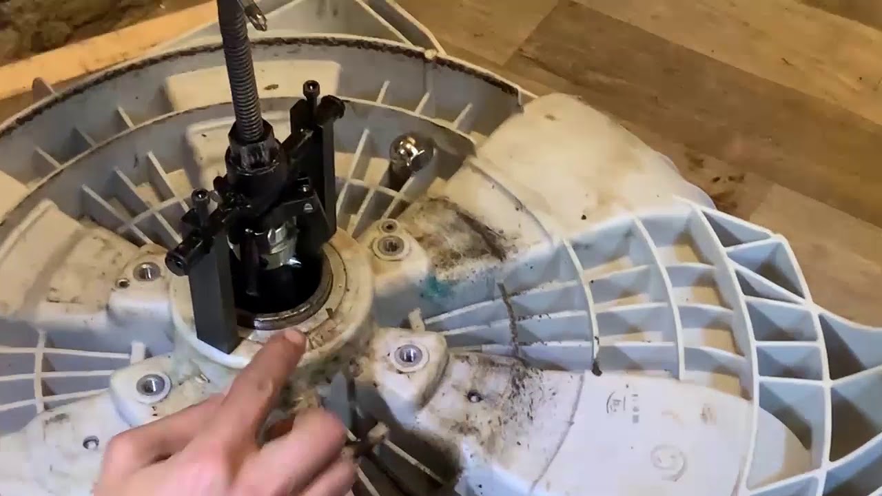 LG Front Loader removing a broken jammed bearing