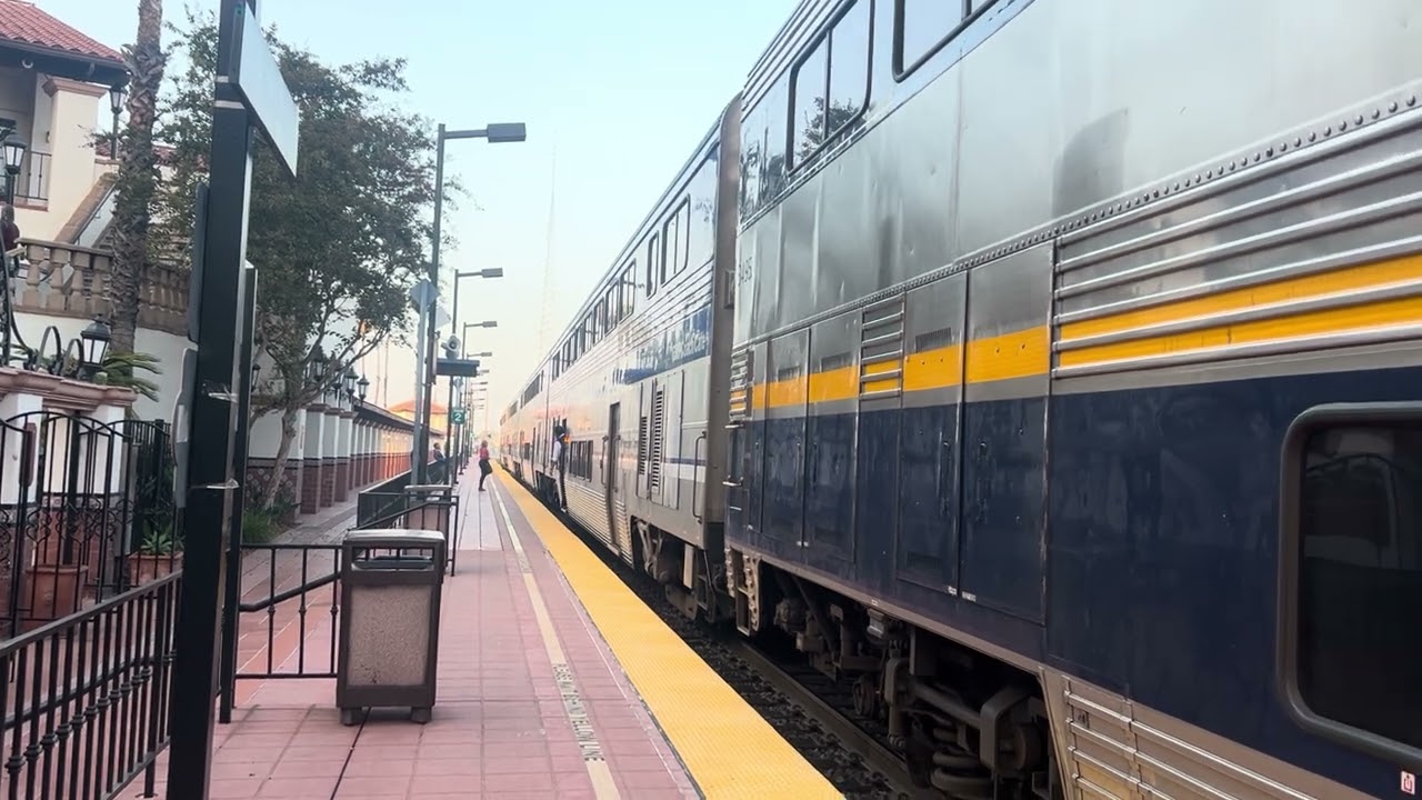 Amtrak cdtx 2118 leads surfliner train 580 with cab car 6901 in Santa Ana station on 12/14/25