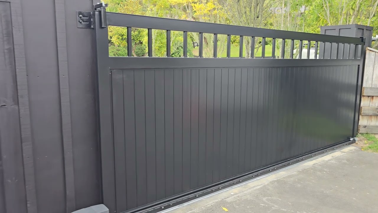 TGV Sliding gate. Black with pedestrian gate. Bar top.