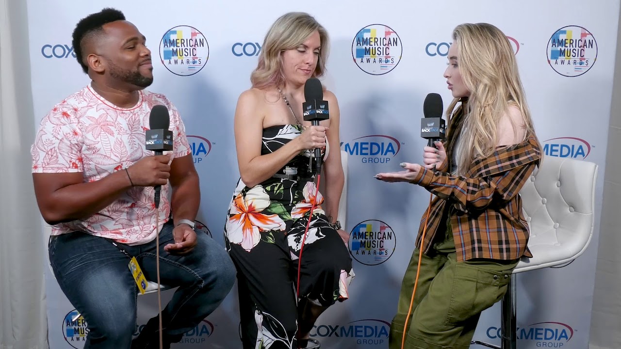 Miguel and Holly talk with SABRINA CARPENTER at the AMAs
