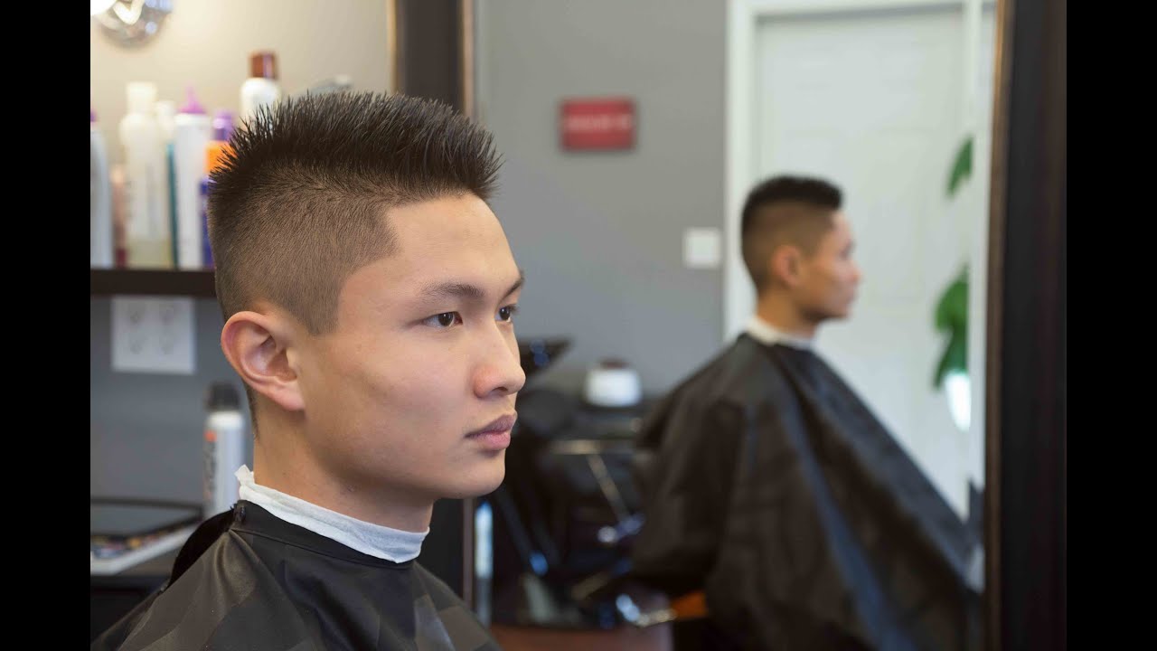 Fade Haircut. Long on top 1 on the sides.