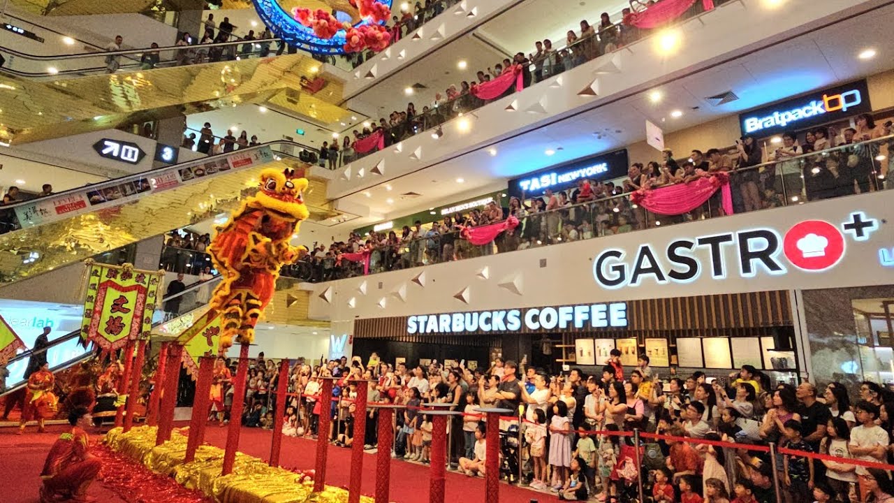 2025 lion dance on high poles at Centrepoint