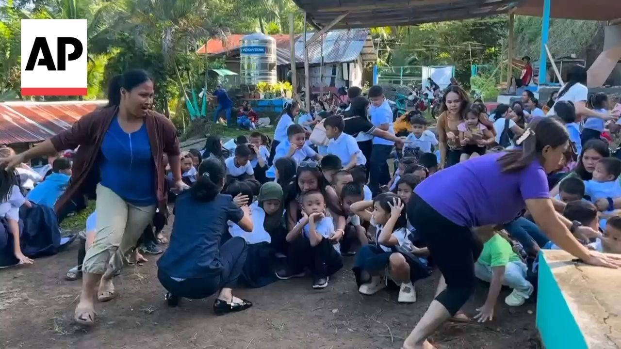 School children scream and cry as 7.8 earthquake shakes the Philippines