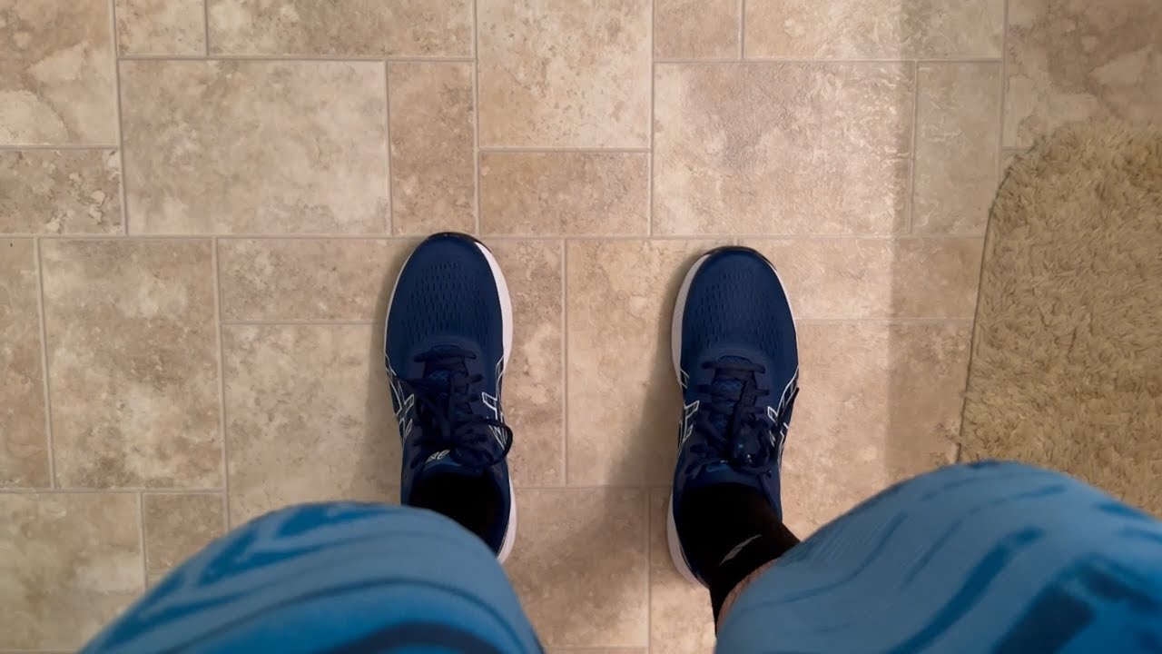Wet ASICS Gel Excite 9 Running Shoes in the Bath