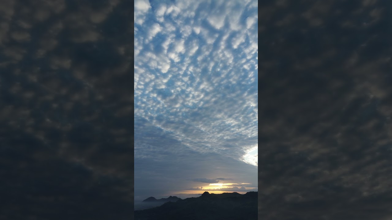 Thin Clouds Floating Over Sunrise Mountains | Drone 