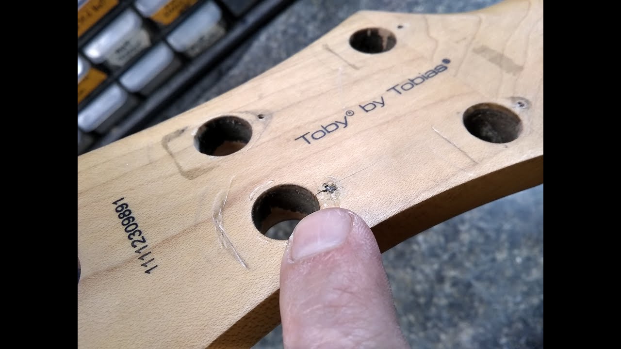 Remove and repair a broken tuner screw on a Toby by Tobias bass guitar