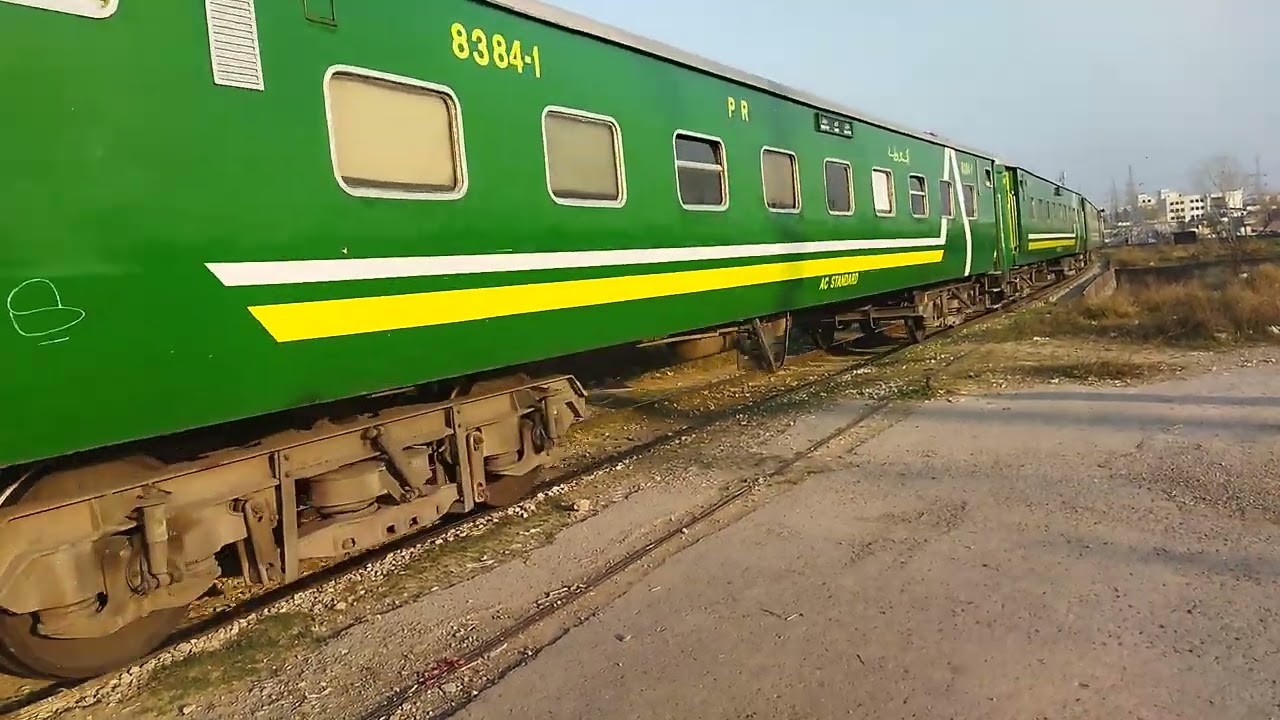 108 DN Islamabad express train crossing Nur junction Railway station with GEU 20-4557