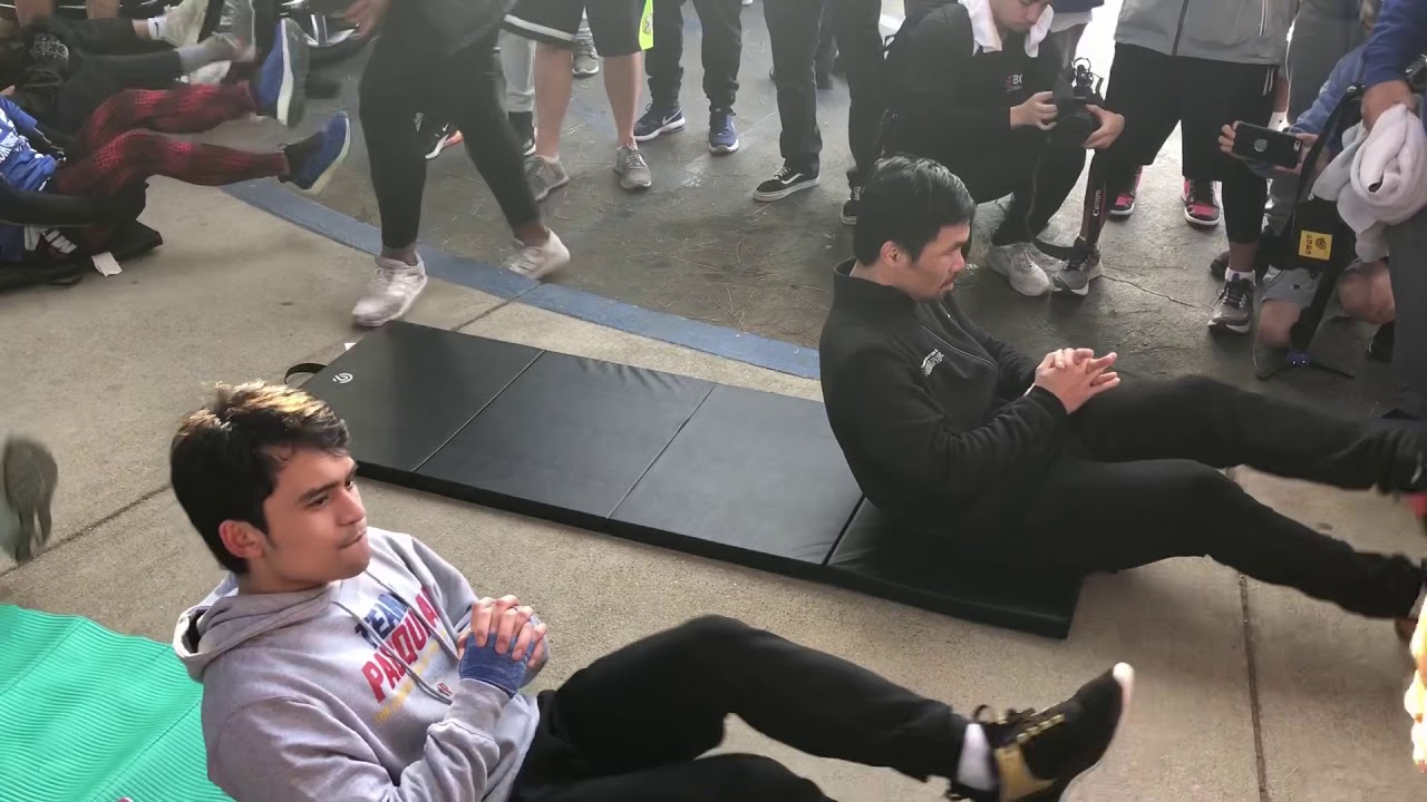 MANNY PACQUIAO spends Christmas training with son.