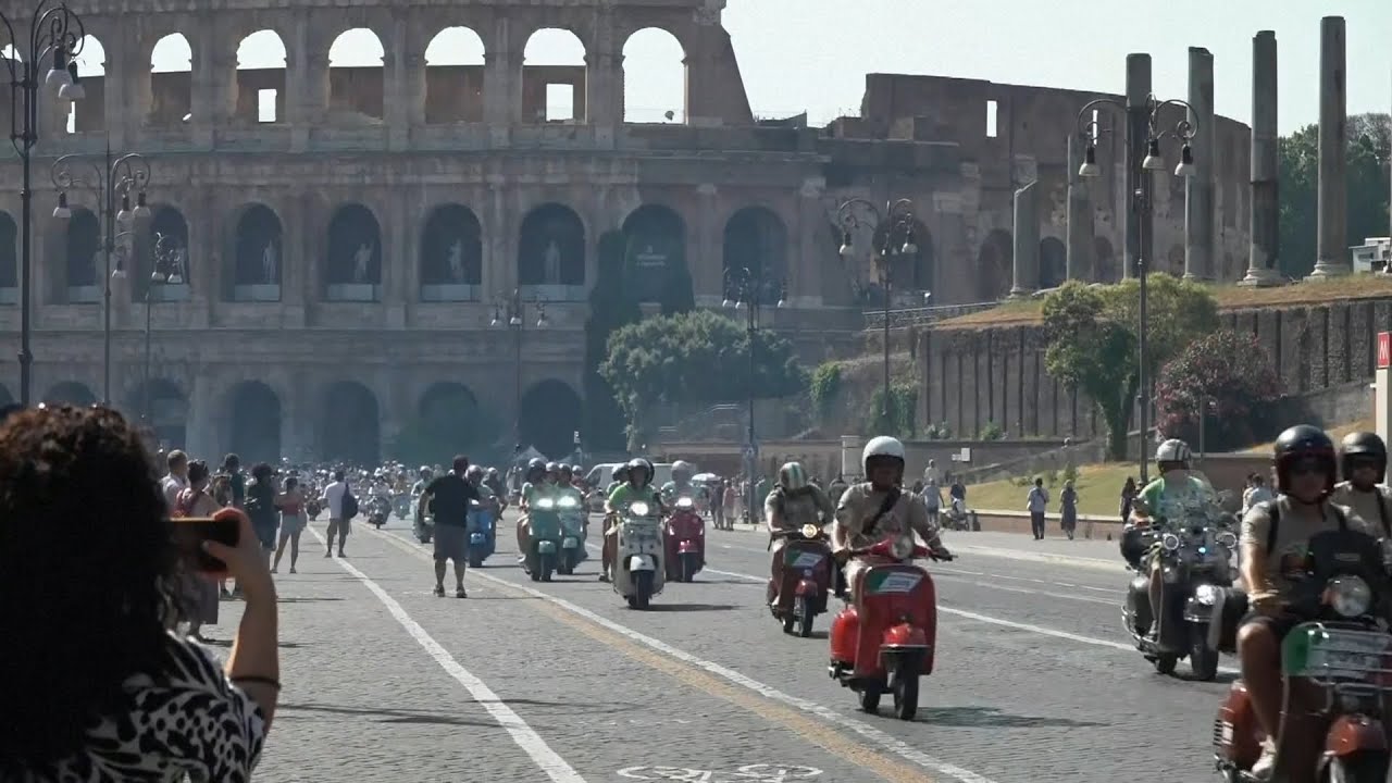 Joyful scenes in Rome as thousands celebrate 80 years of Vespa