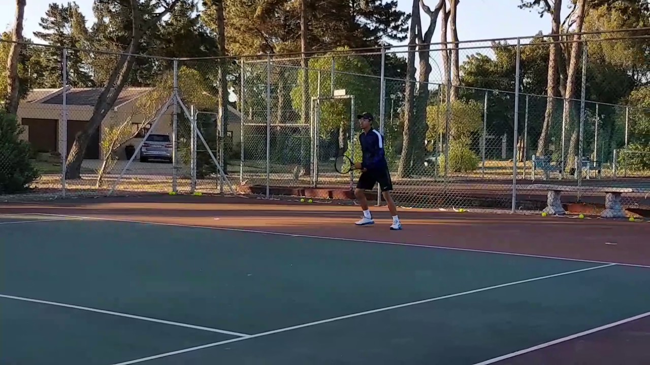 Christopher tennis practice - working hard