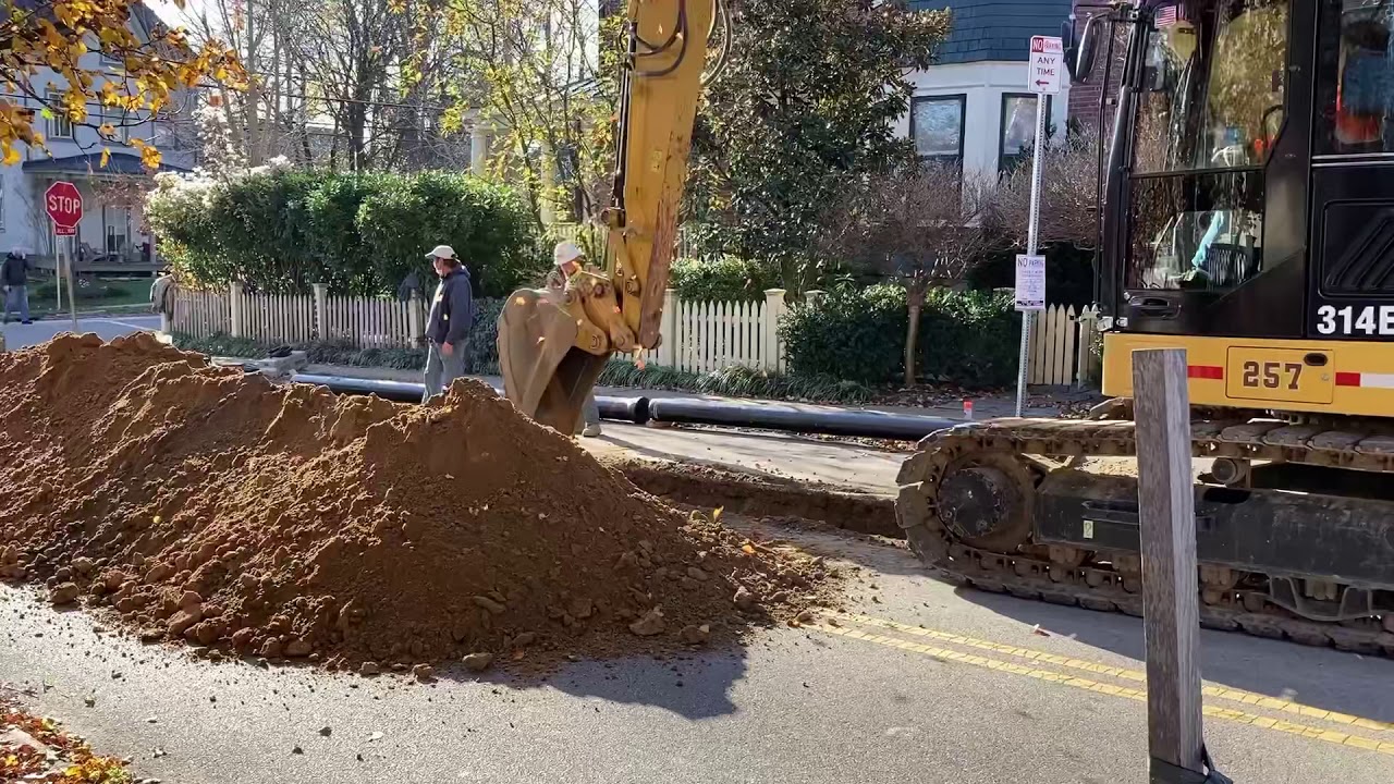 Digging trenches, laying water mains