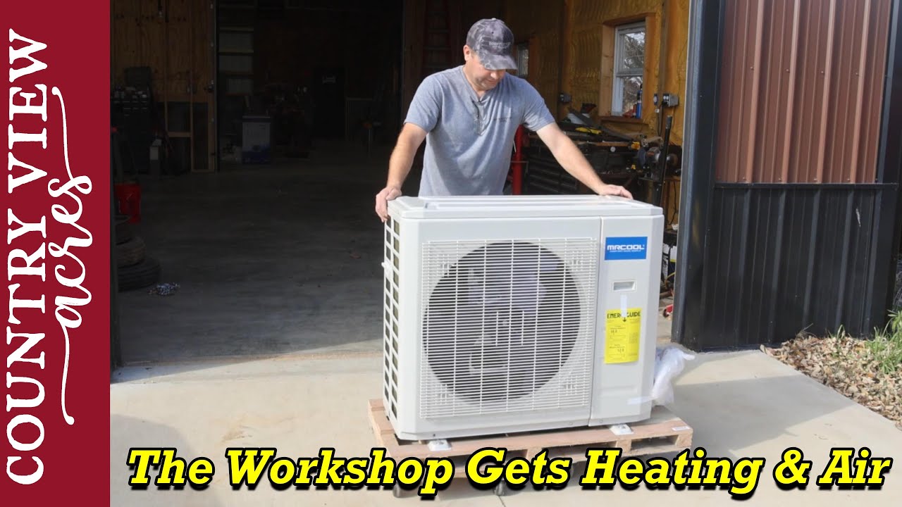 The workshop will be nice to work in year round.  Installing a Mr. Cool Heat pump in the workshop.