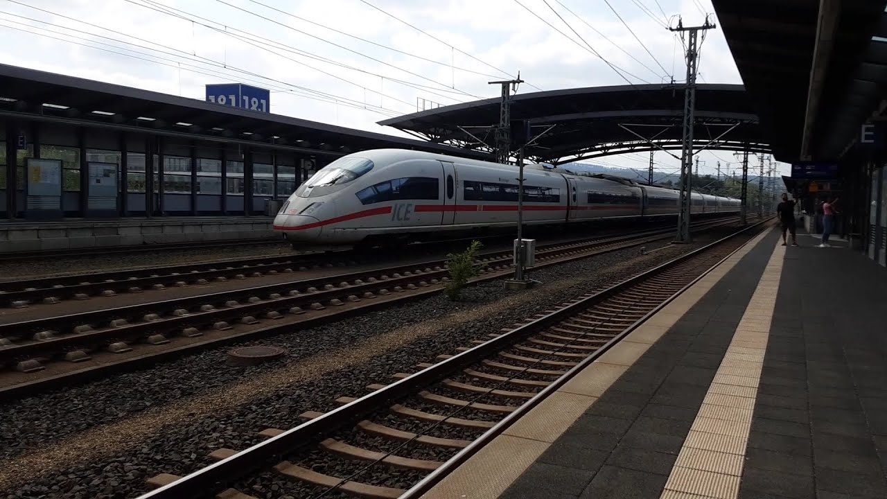 Trains arriving leaving passing Montabauer