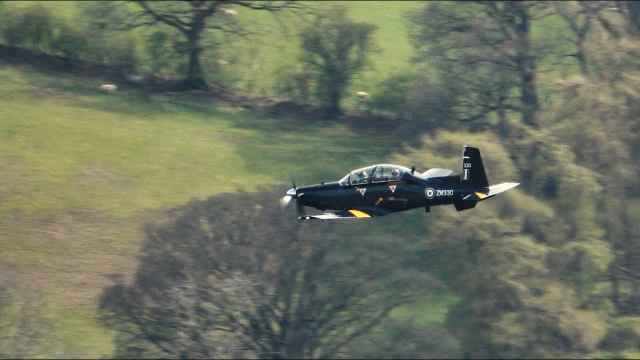 An RAF Hawk T2, RAF Texan and RAF Phenom on a windy day over Ullswater in the Lake District UK.