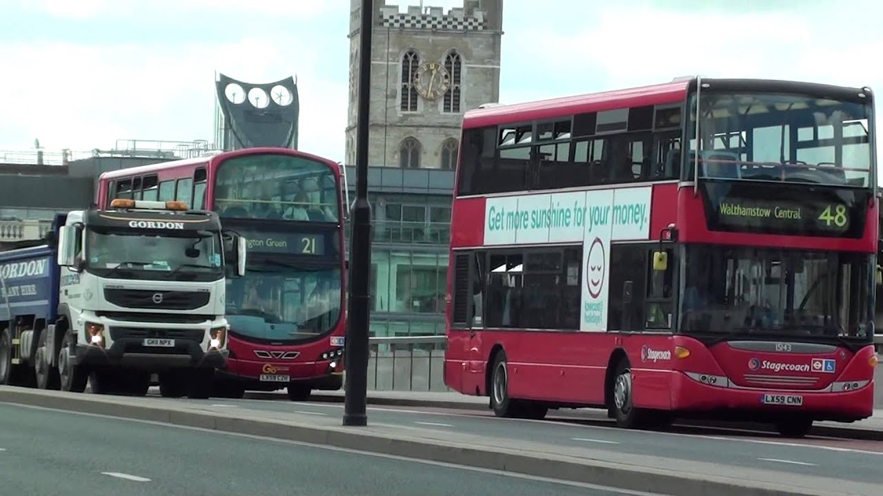 (HD) A variety of London Buses crossing London Bridge in both directions