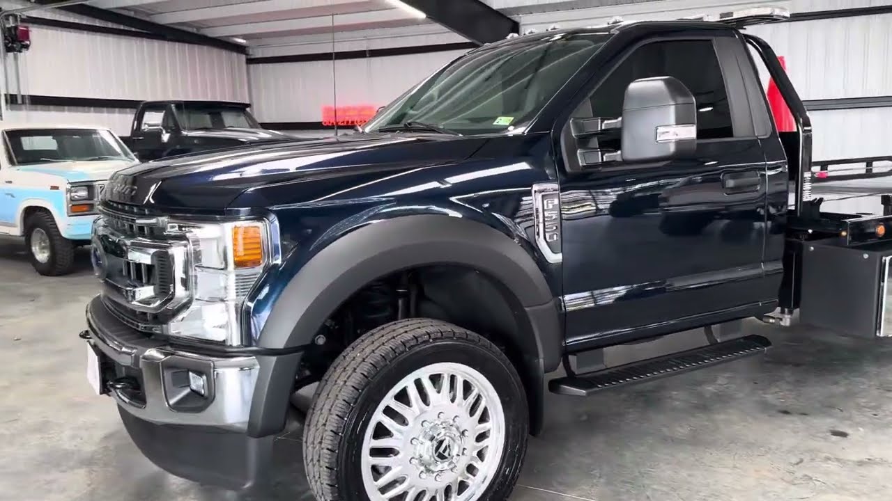 Customized flatbed rollback tow truck for sale f550 22” custom wheels and in the ditch accesories !!