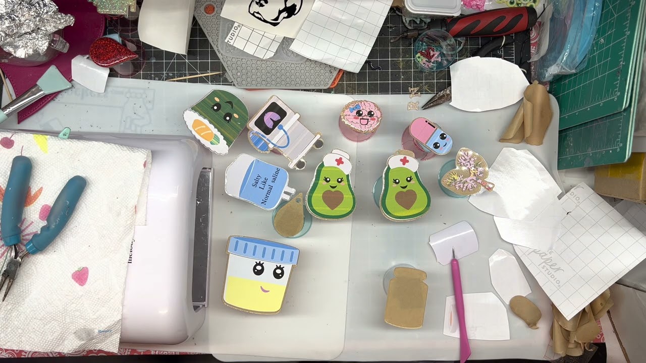 Creating custom badge reels using acrylic blanks and UV resin.
