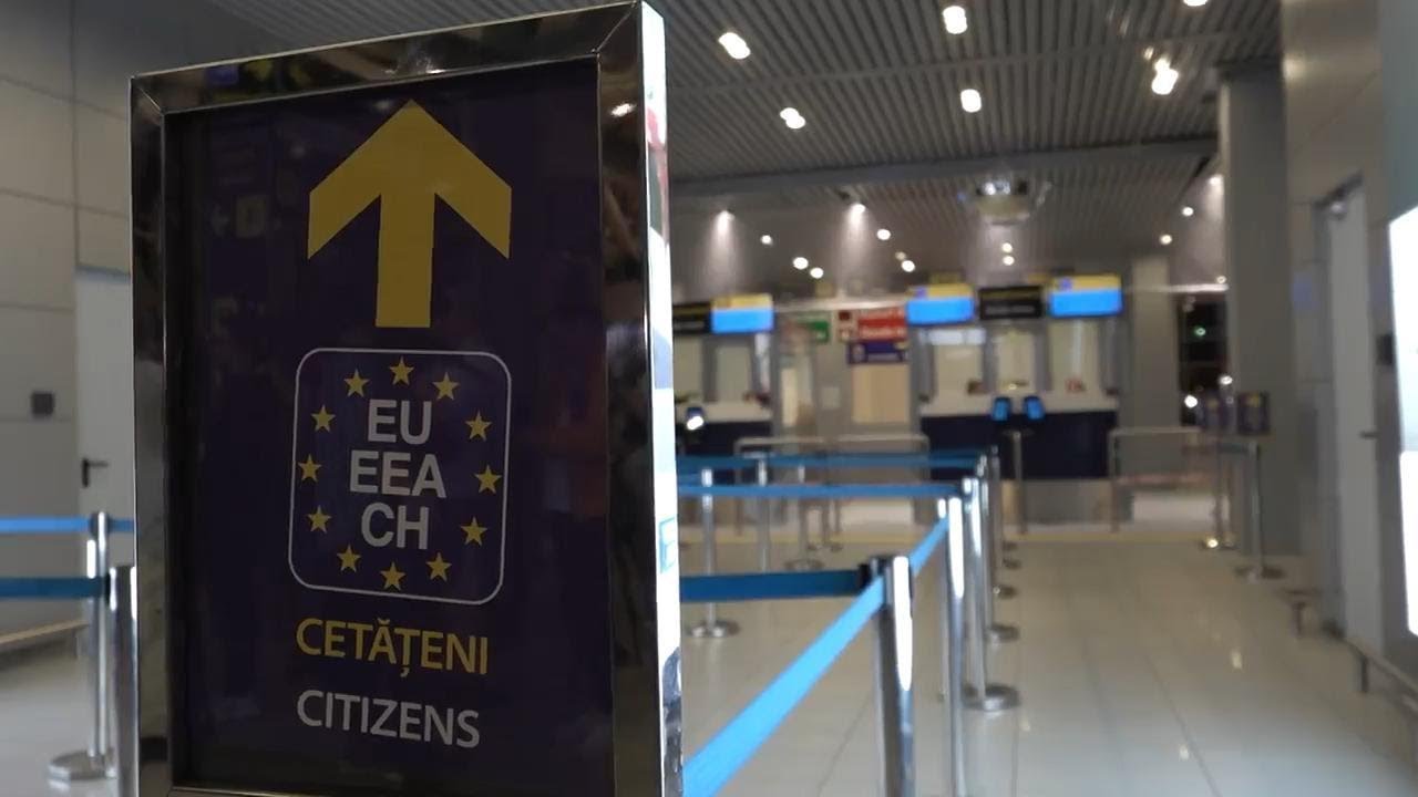 Travellers arrive at Bucharest airport as passport and visa checks for Schengen area passengers are
