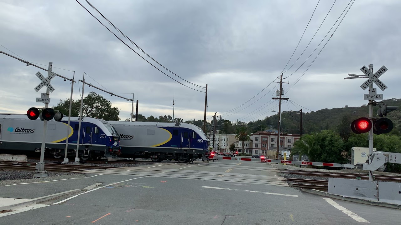 Two Amtrak Capitol Corridor trains meeting at the railroad crossing at Berrellesa St, Martinez, CA