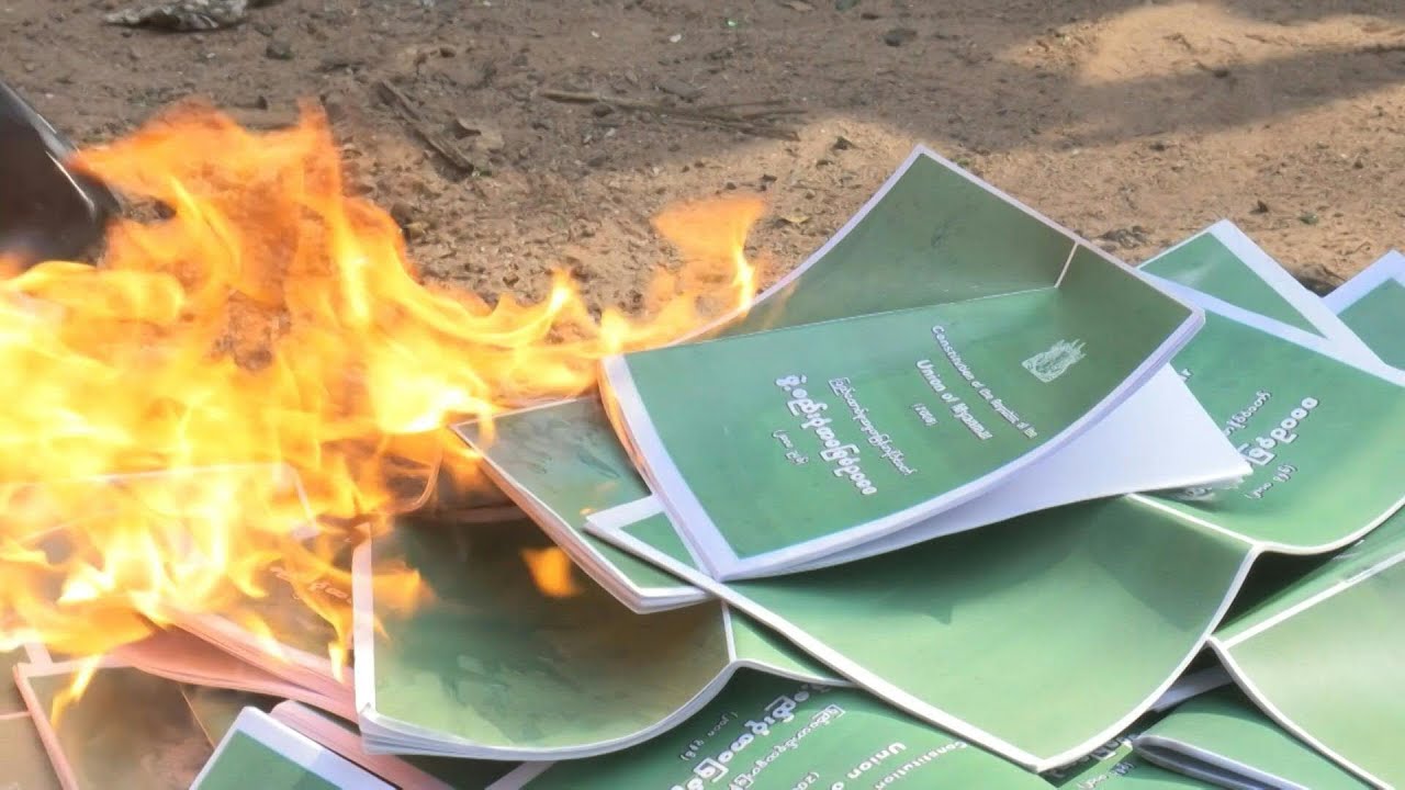 Yangon protesters burn copies of military-drafted 2008 constitution | AFP