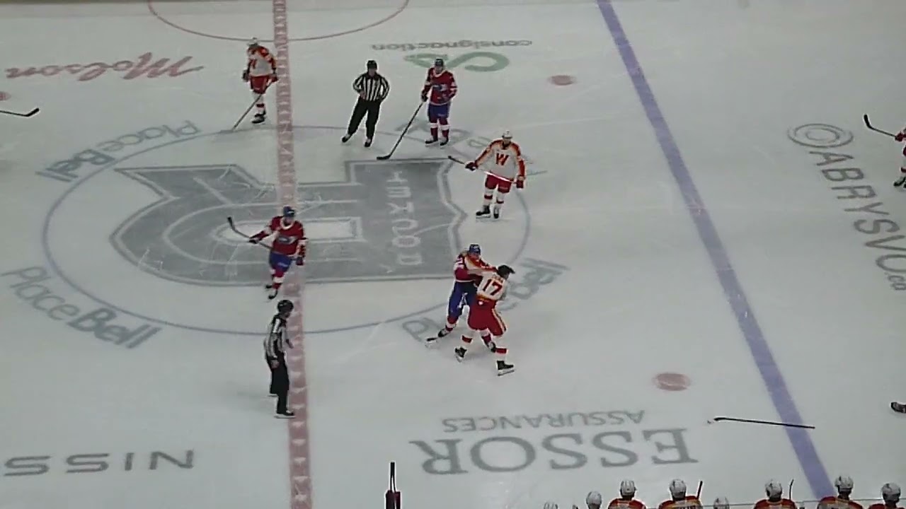 Laval Rocket's Florian Xhekaj and Calgary Wranglers'  Lucas Ciona get into a fight 4/4/26