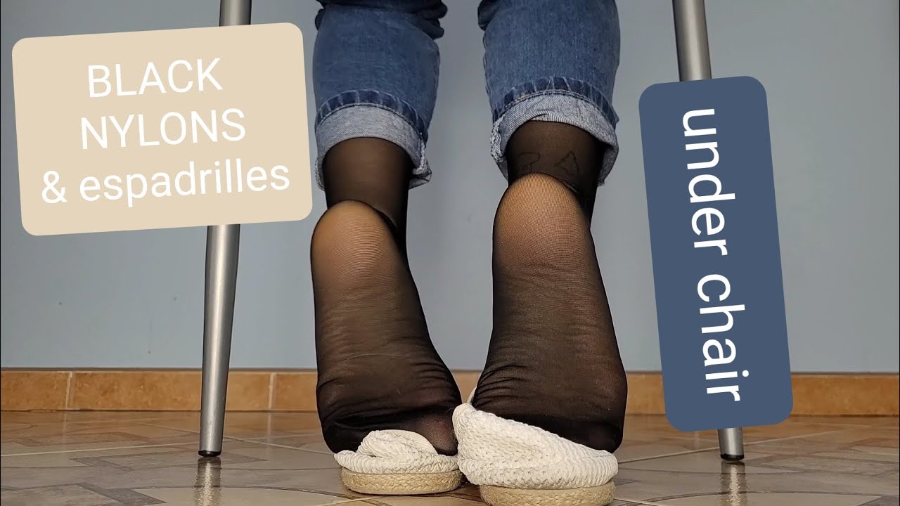 #98 sheer black pantyhose and white espadrilles shoeplay on the ground, under chair (+ no shoes)