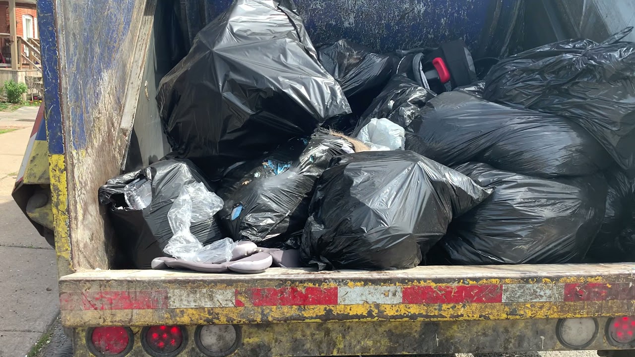 Rear load packing garbage pile