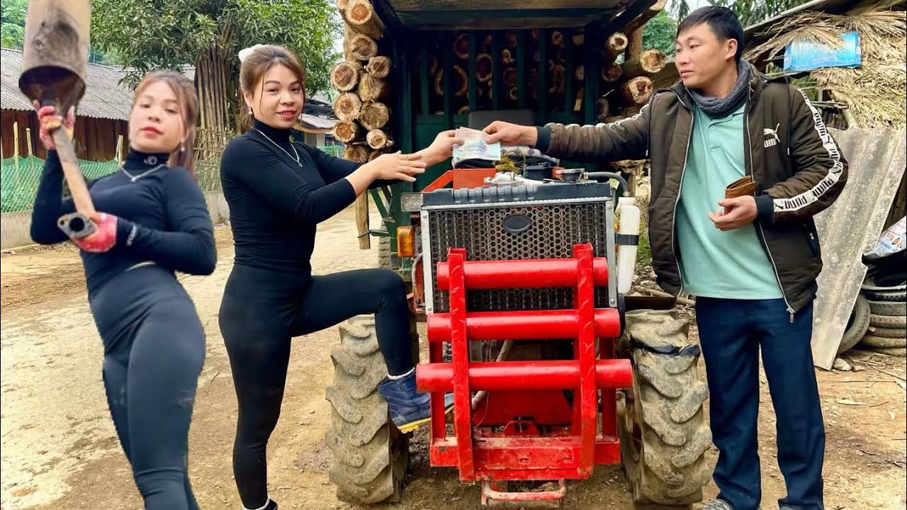 Talented girl: repairing a tractor that broke down while transporting wood.