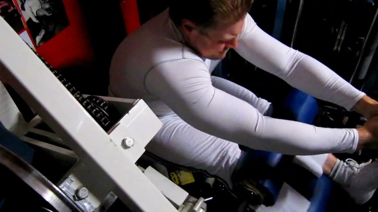 Michael Gundill performs seated leg curls for hamstrings